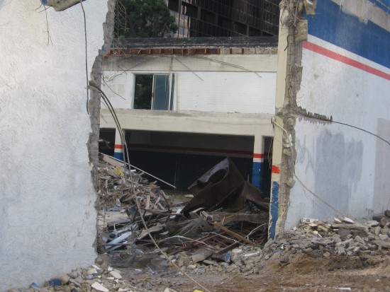 A big hole in one wall of the former Brake Depot.