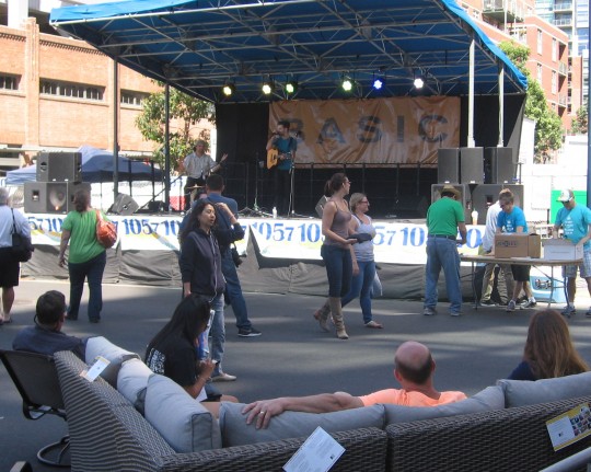 People relax and enjoy live music on Padres Opening Day.