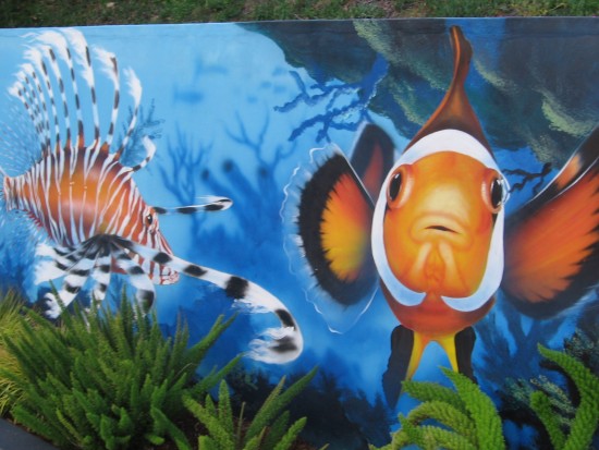 More exotic fish on a parking lot wall.
