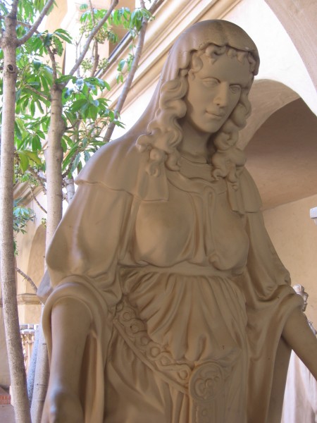 Freestanding figure of a woman in flowing robes titled Religion.  It stood atop the 1914 retablo of the Varied Industries Building.