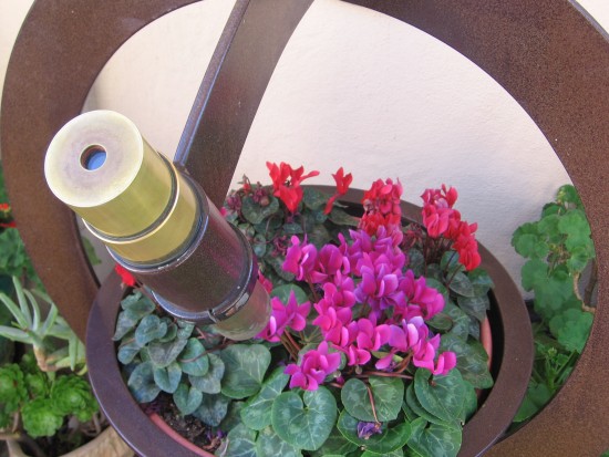 A kaleidoscope aimed at turning bowl of flowers.