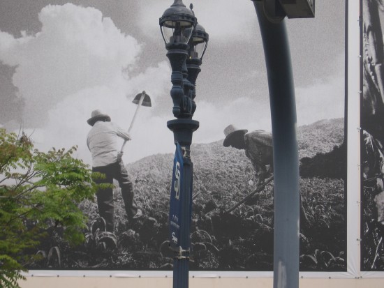 Public art includes farm workers on the empty city warehouse.