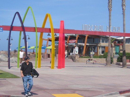 Abstract surfboards welcome people to Imperial Beach pier.