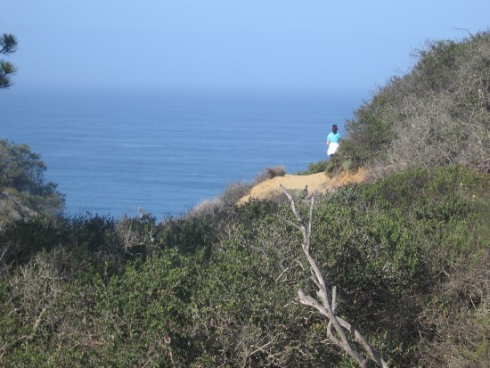 A glance back toward the ocean and a lone walker.