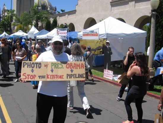 Activist at EarthFair fights the Keystone Pipeline.