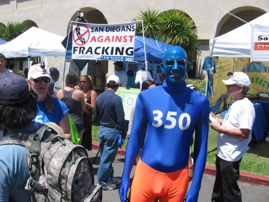 Man painted blue advocates for lower carbon emissions.