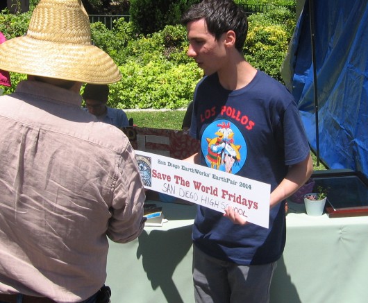 High school student with Save the World Fridays sign.