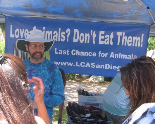 Banner in booth opposes eating animals.