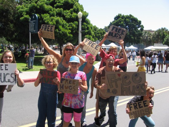 Free hugs are offered to visitors of Balboa Park's EarthFair!