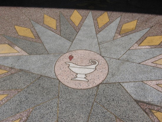 The lamp of learning still burns on the little-used sidewalk.