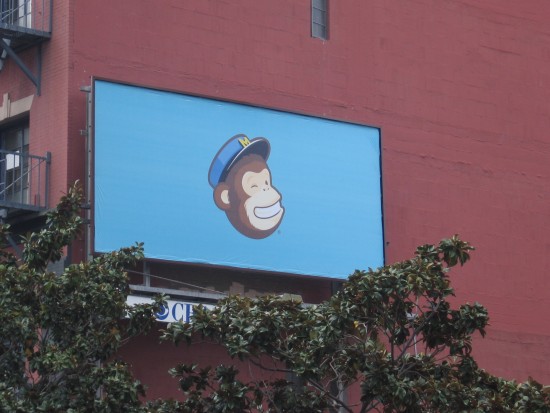 Grinning monkey head on billboard in San Diego.