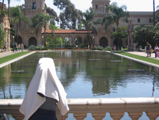 Photographer at work beside Balboa Park's reflecting pool.