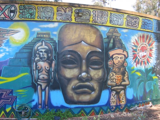 A variety of bold faces gaze in every direction from the mural.