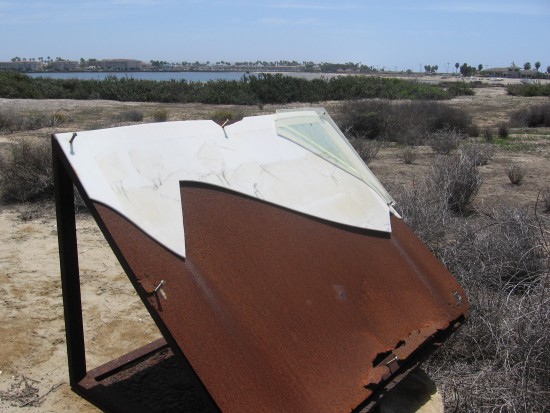 Information sign rusted and unreadable.