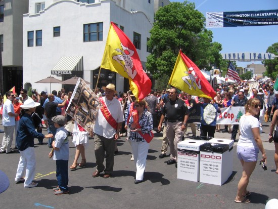 Sicilian Festival dignitaries parade flags down India Street.