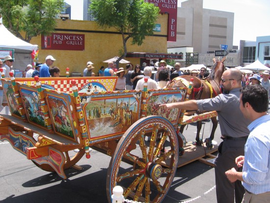 Wagon painted with colorful scenes of Medieval chivalry.