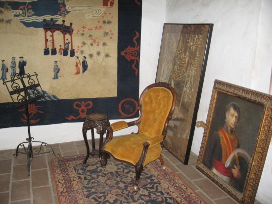 Camera's flash illuminates one interior room.