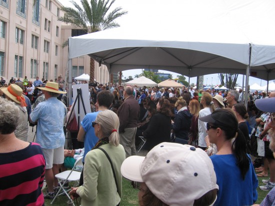 VIPs and public listen to many speeches.