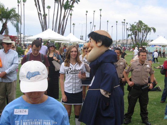 The Padres' friar mascot circulates in the crowd.
