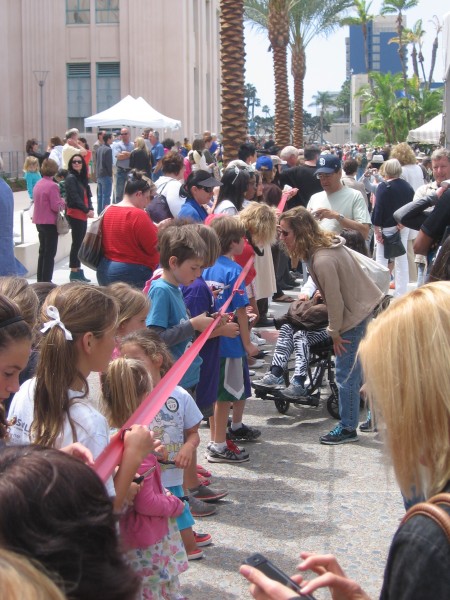 Everyone positions to cut the park-length ribbon!