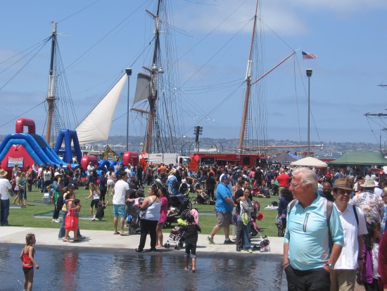 Star of India and waterfront behind opening day crowd.