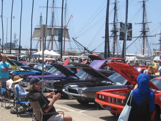 San Diego Maritime Museum behind classic cars.