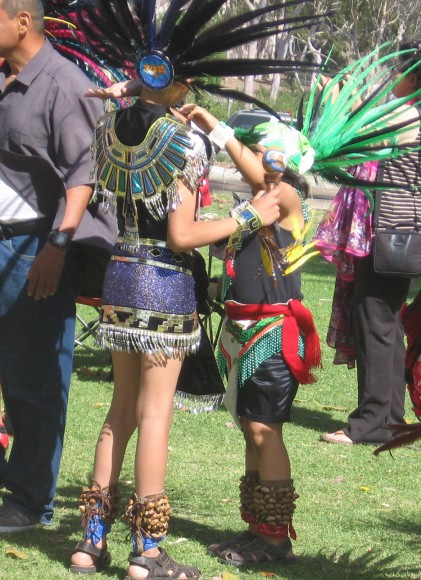 Adjusting costumes before performing a dance.