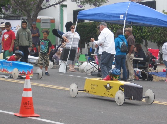 Here they come! Racers speed past spectators!