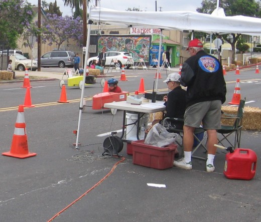 Announcer at finish line watches the action!
