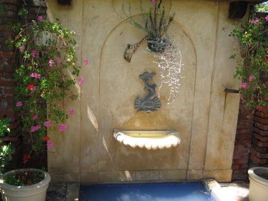 Small fountain at end of garden.