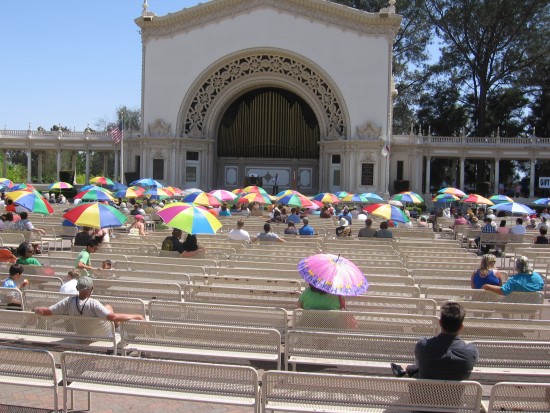 Organ lovers enjoy shade under the San Diego sun.