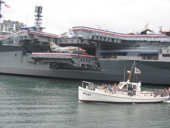 Pilot boat cruises near USS Midway on Memorial Day weekend.