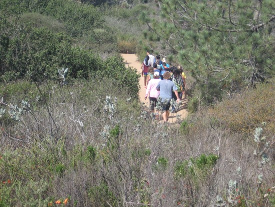 Hikers take beautiful trail through coastal chaparral.