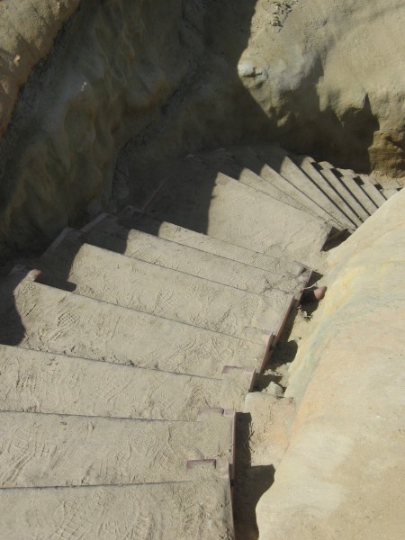 Steps head steeply down from cliffs.