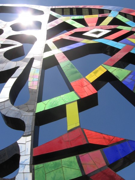 Closer look at light shining from mosaic sculpture.