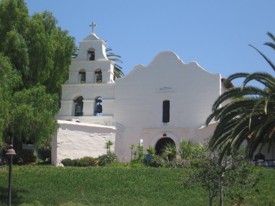 Facade of old Mission San Diego seen from parking lot.