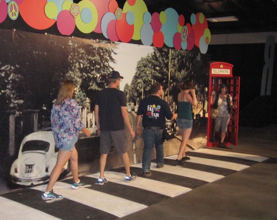 People pose to recreate old Beatles album cover.