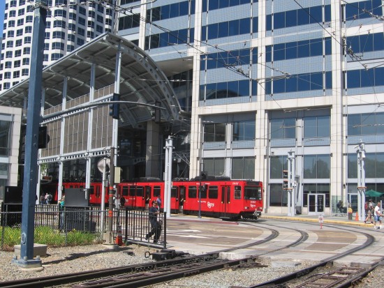 San Diego Trolley stops at cool America Plaza station.