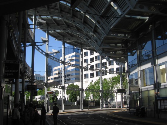 Taking a walk through the shady station on a sunny day.