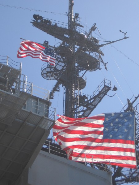 Patriotic flags on USS Midway superstructure.
