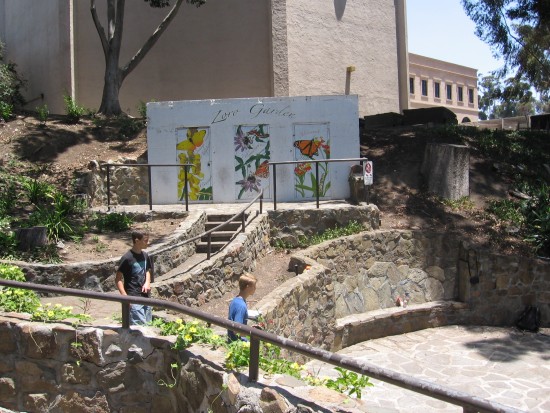 People enter the seldom-used, charming Zoro Garden.