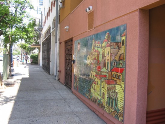 Looking down the sidewalk where the mural is located.