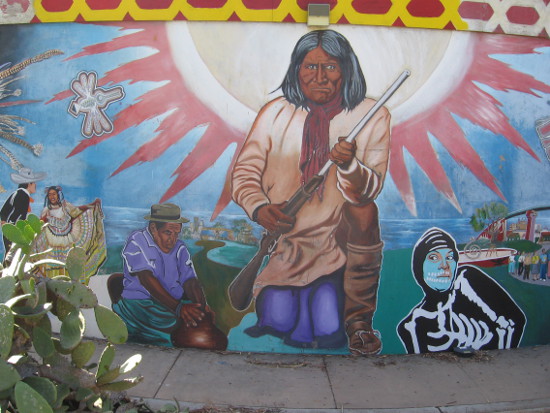 Geronimo crowned by a radiant sun.