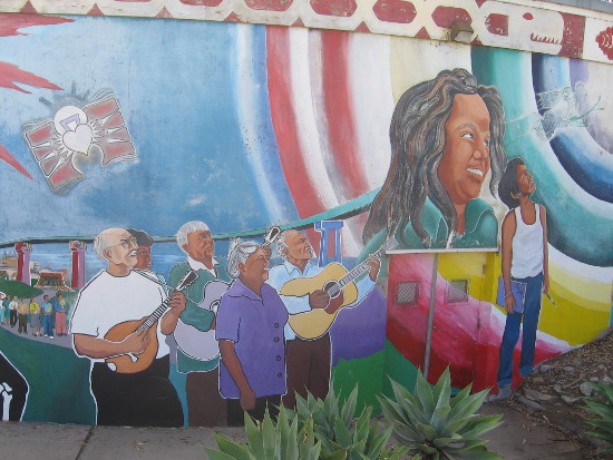 Hispanic music, education and optimism are portrayed.