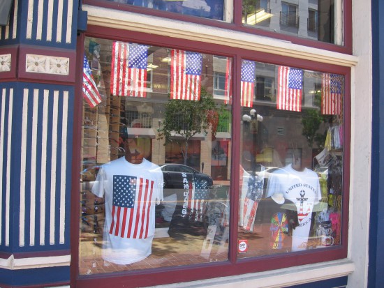 Shop window in the Gaslamp filled with American flags.