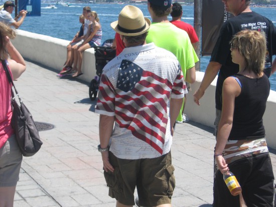 Many in the crowd are wearing patriotic clothing.