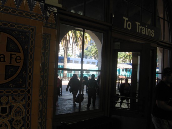 Coaster train can be seen waiting outside on one track.