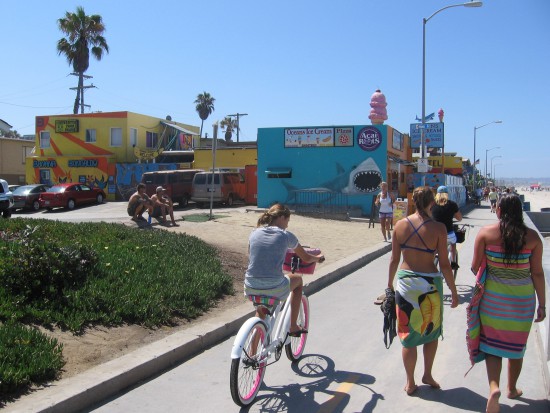 Folks head toward a shark and big ice cream cone!