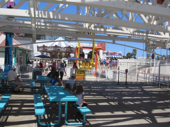 Entering Belmont Park beneath the wooden roller coaster.
