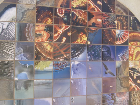 Photo mosaic on beach restroom shows bits of Belmont Park.